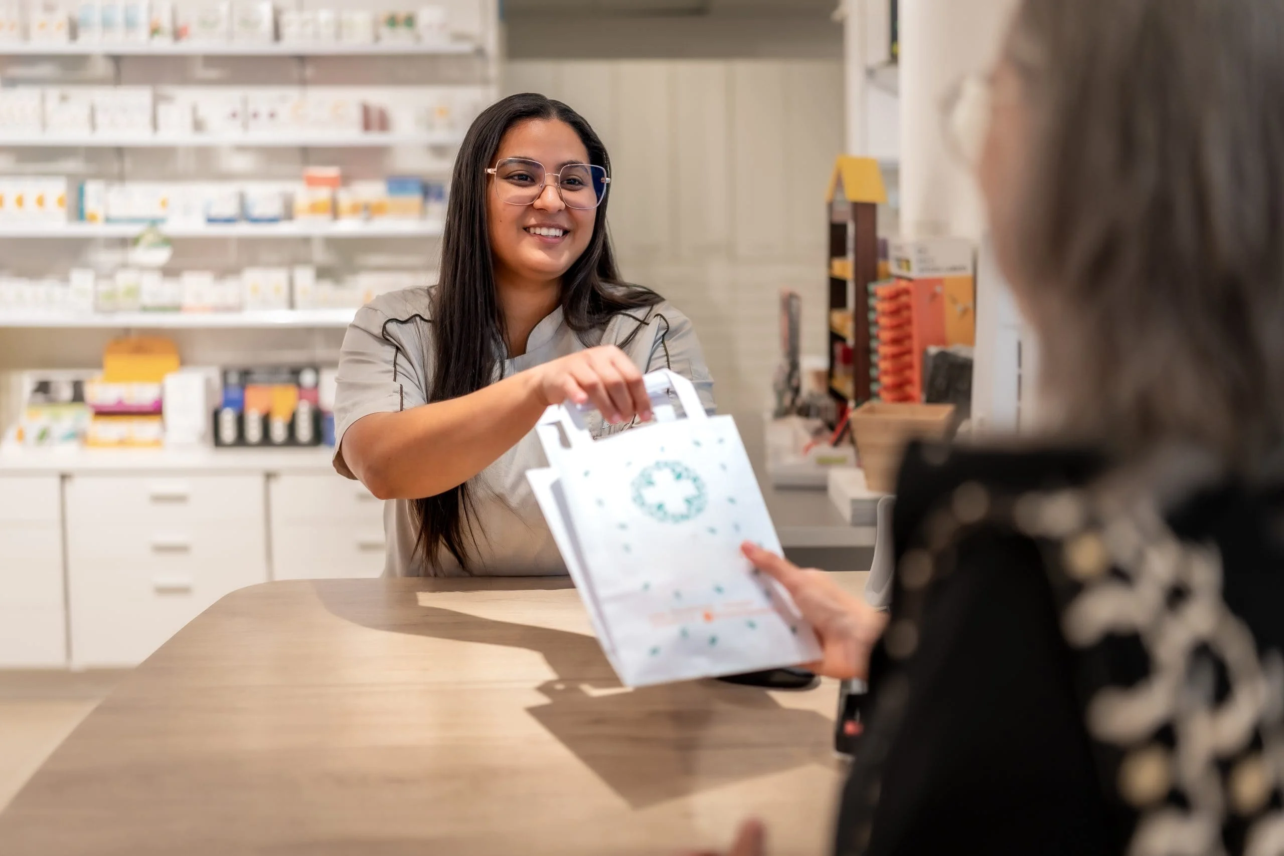 Pharmacist providing patient care